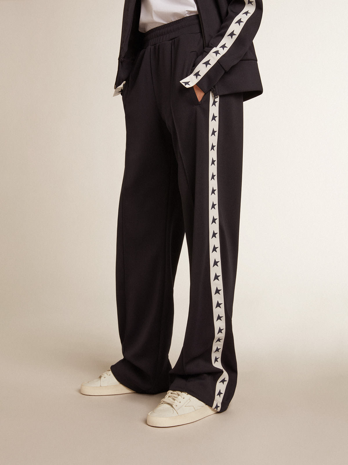 Dark blue joggers with white strip and contrasting stars