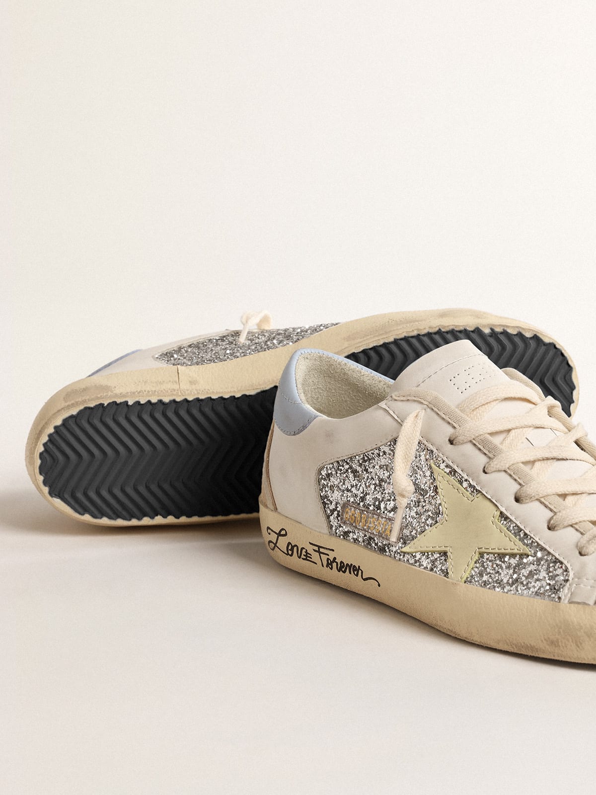 Golden Goose - Bio-based Super-Star with silver glitter and yellow leather star in 