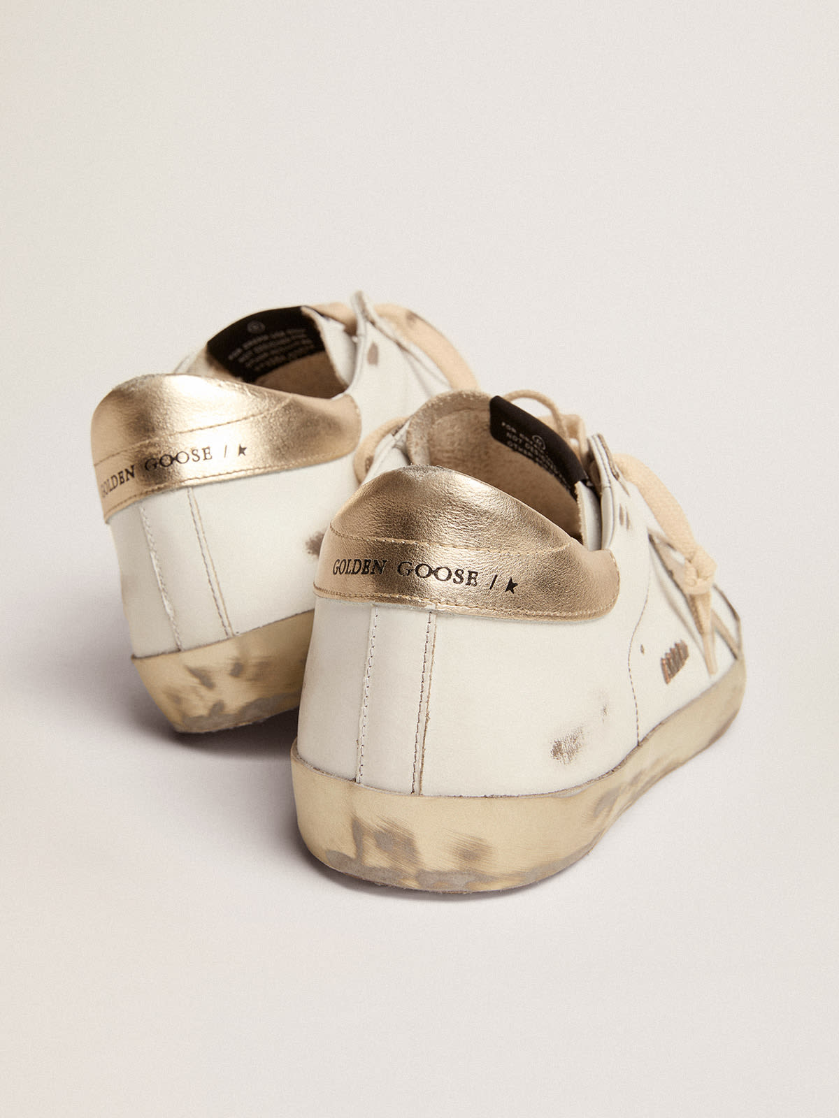 Golden Goose - Men’s Super-Star sneakers with gold sparkle foxing and metal stud lettering in 