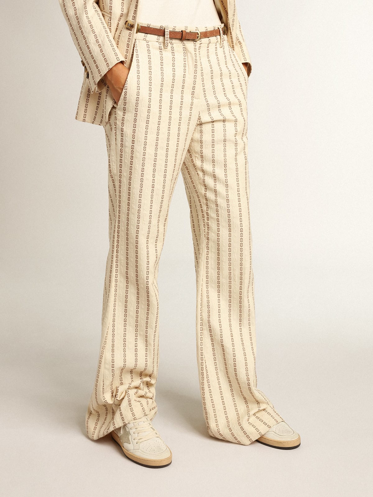 Cream-colored cotton pants with jacquard motif
