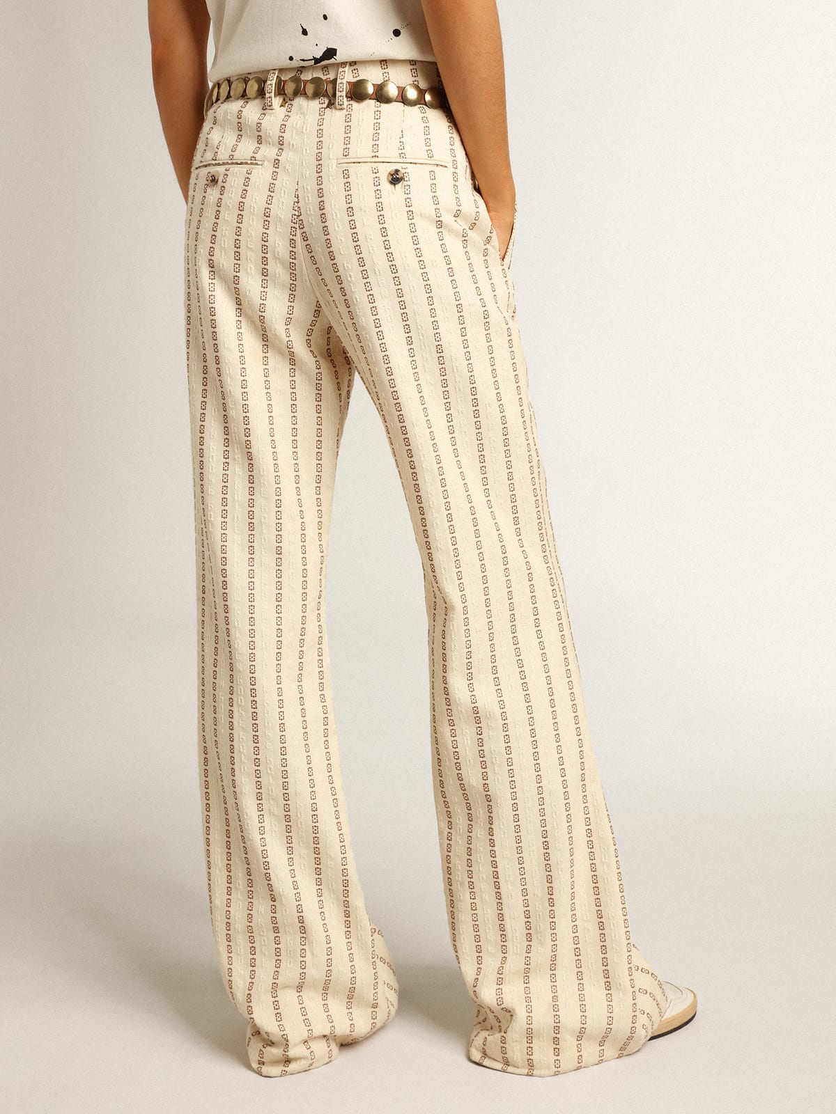 Cream-colored cotton pants with jacquard motif