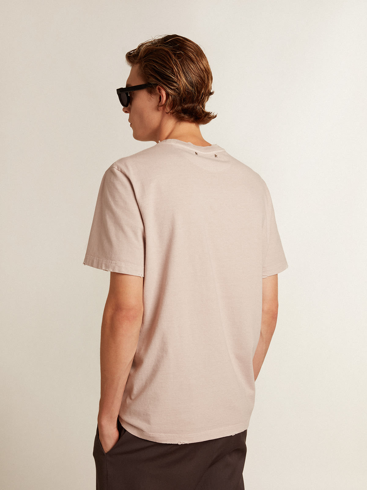 Pale pink men's T-shirt with lettering in the center