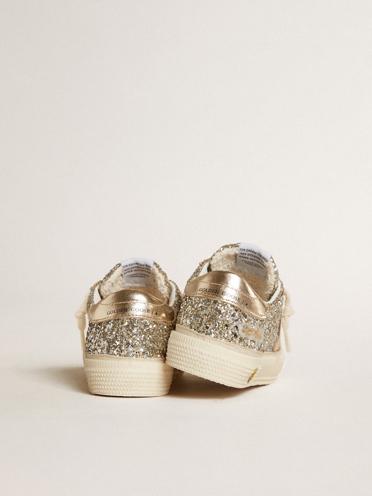 May Young in platinum glitter with metallic leather star and heel tab ...