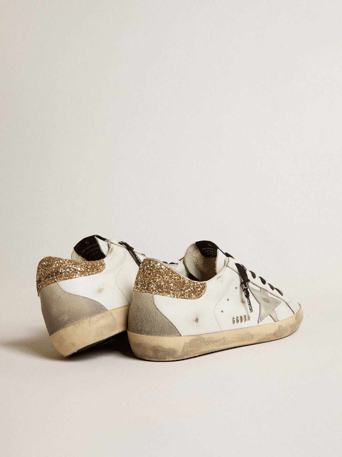 Golden Goose - Women's white leather Super-Star sneakers with glittery heel tab in 