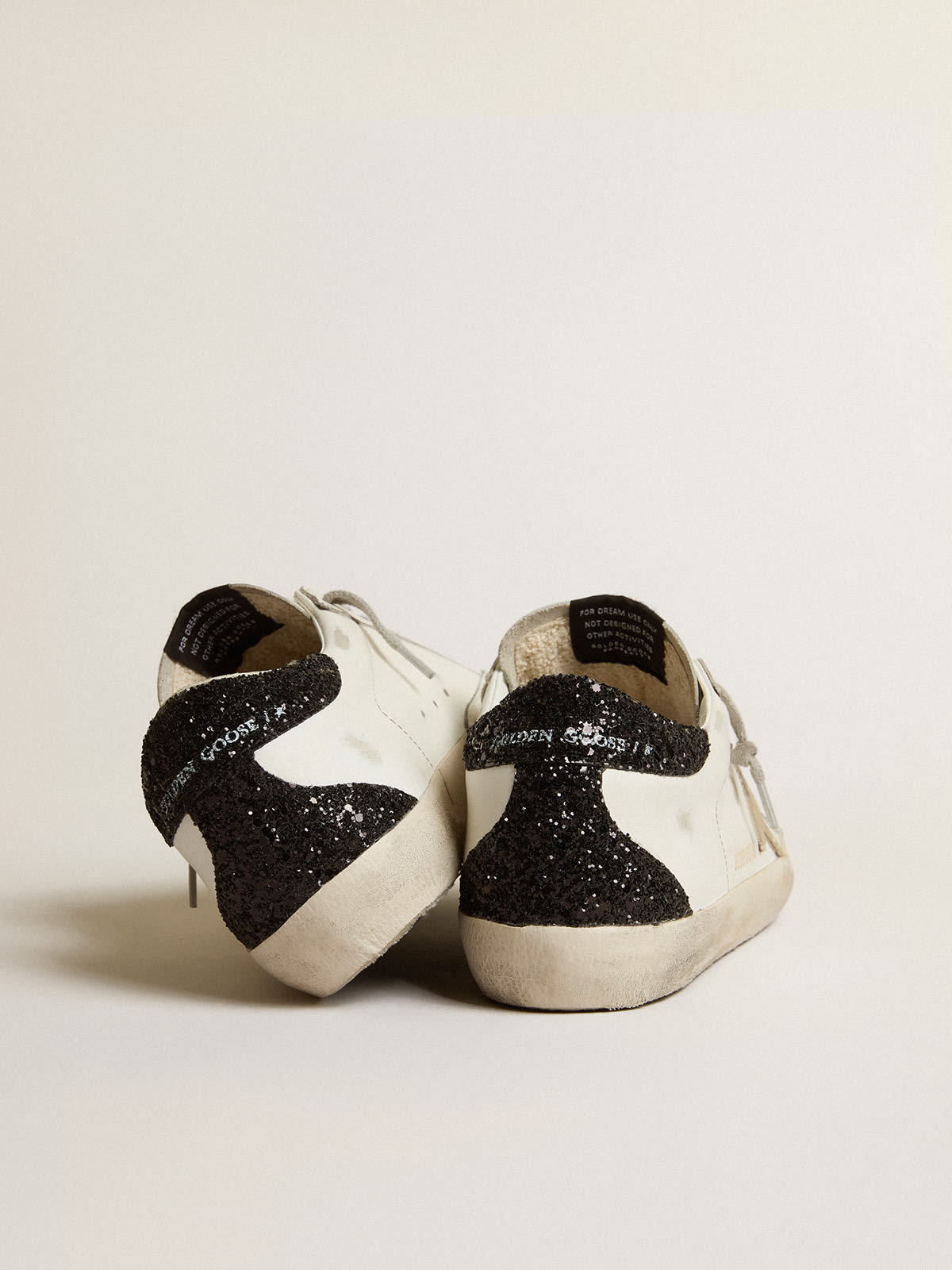 Golden Goose - Women's Super-Star with gold star and black glitter heel tab in 