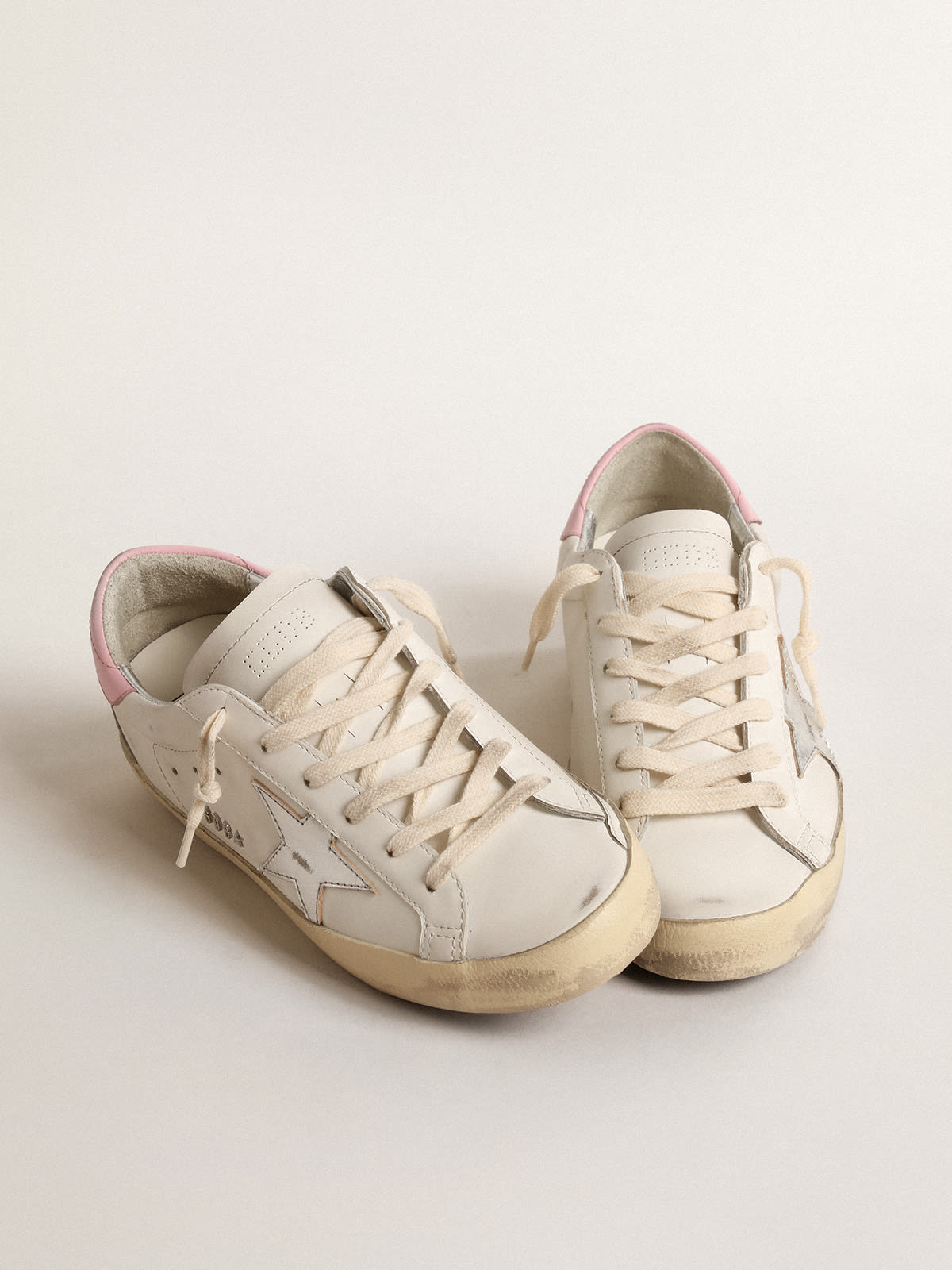 Super-Star sneakers in white leather and canvas with shocking-pink leather  star and silver glitter heel tab