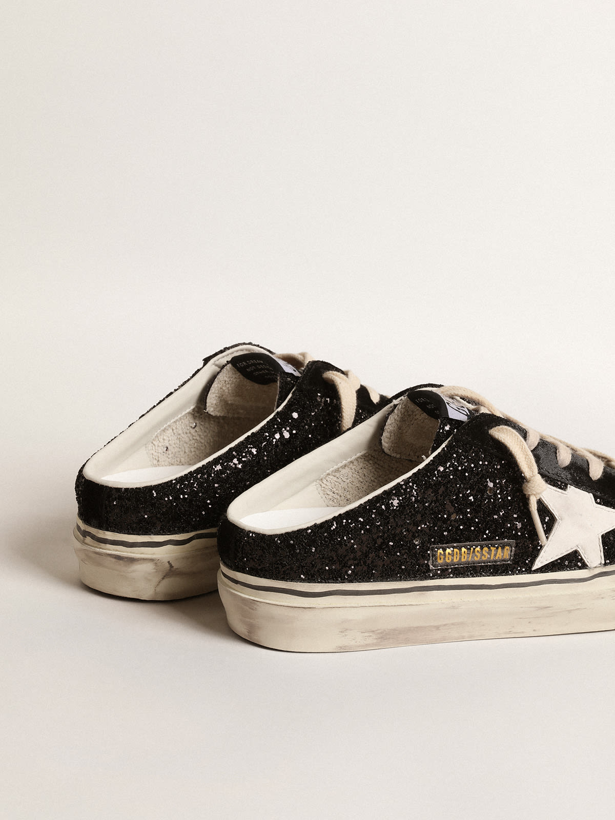 Golden Goose - Super-Star Sabots in black glitter with white bio-based star in 