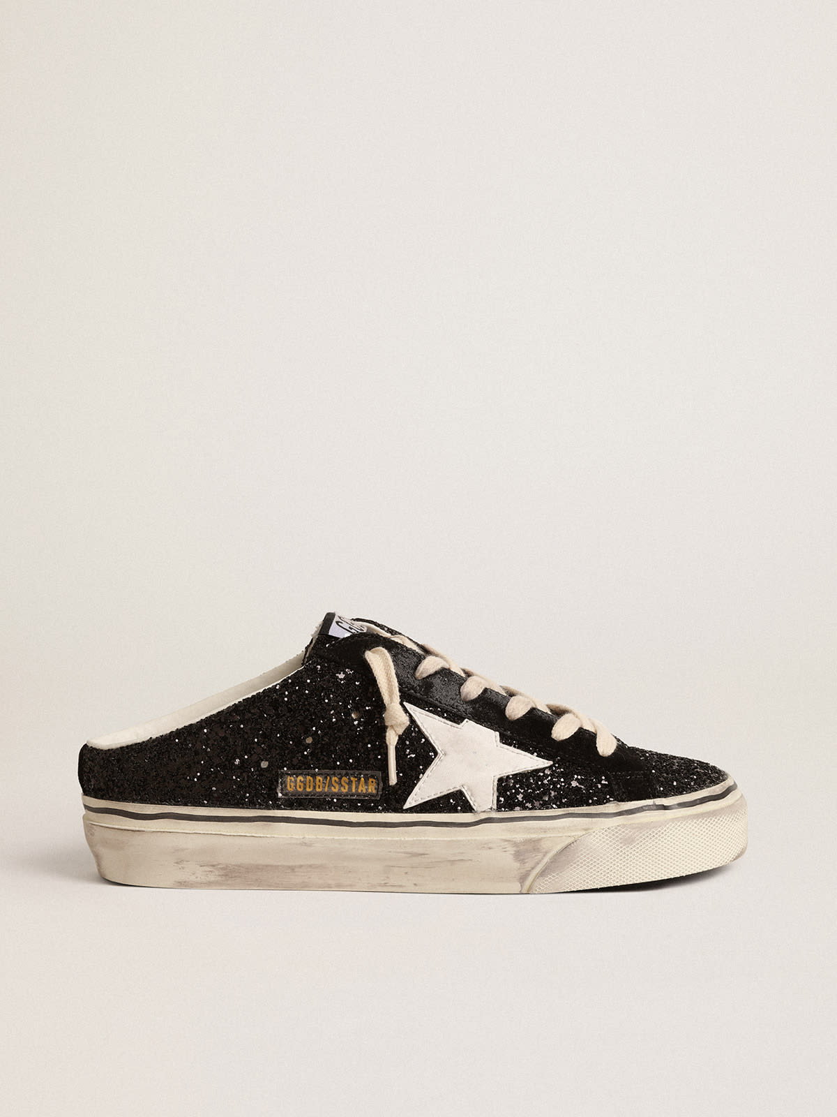 Golden Goose - Super-Star Sabots in black glitter with white bio-based star in 