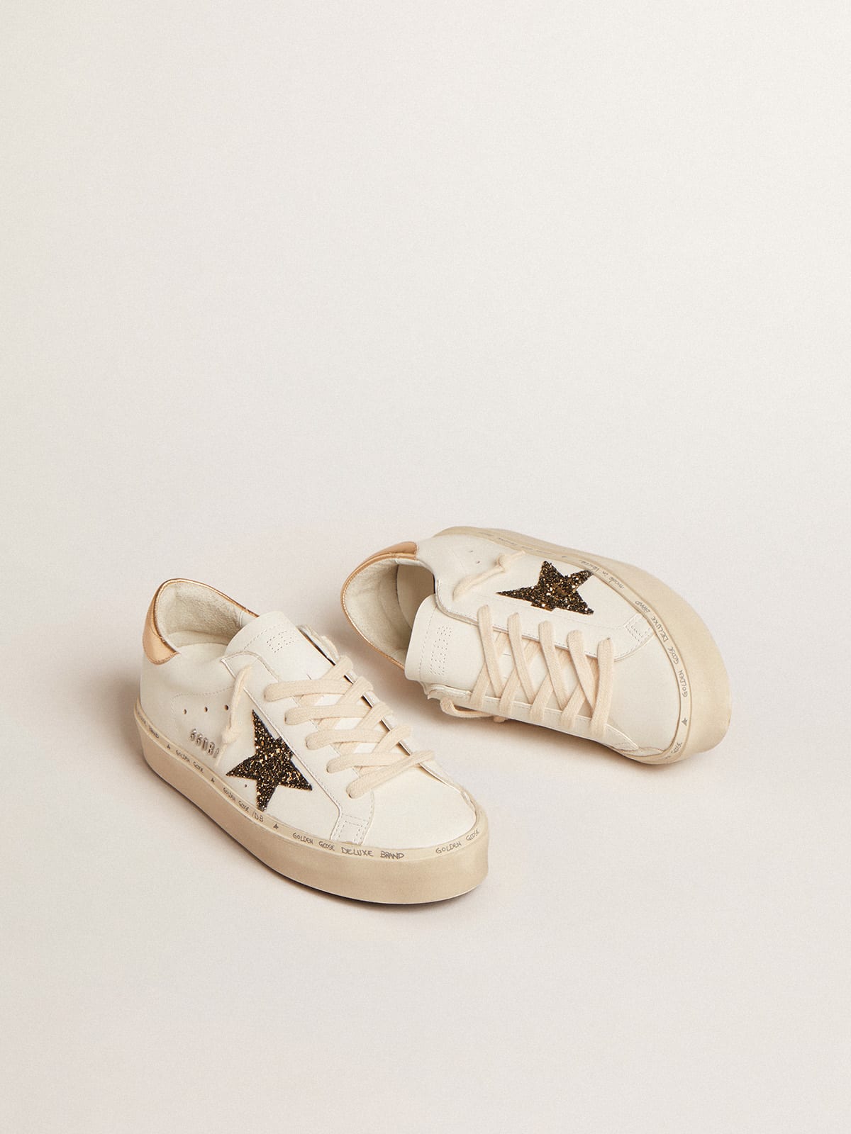 Golden Goose - Hi Star LTD with black and gold glitter star and gold heel tab in 