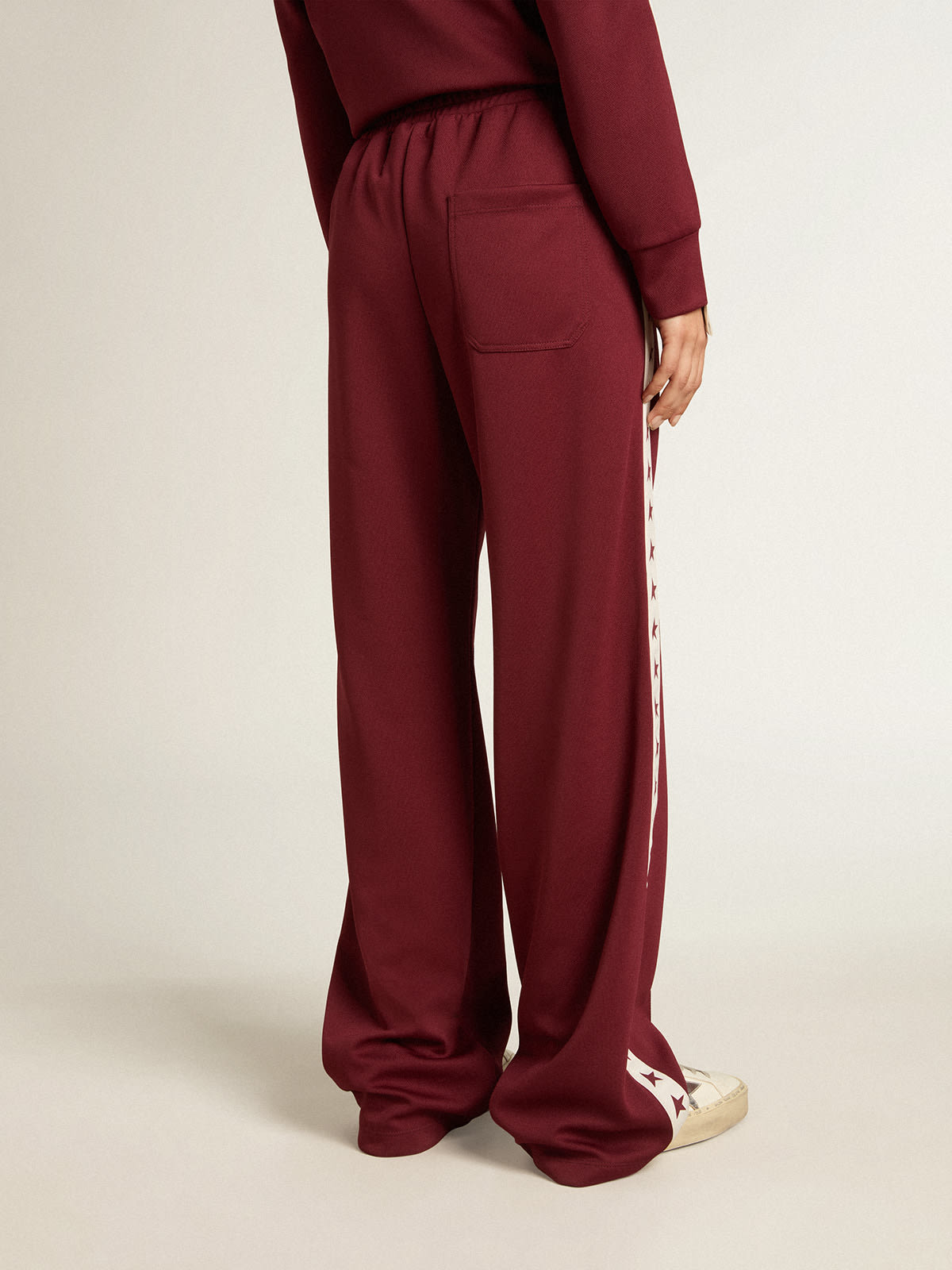 Pantalon de jogging bordeaux pour femme avec toiles sur les c t s