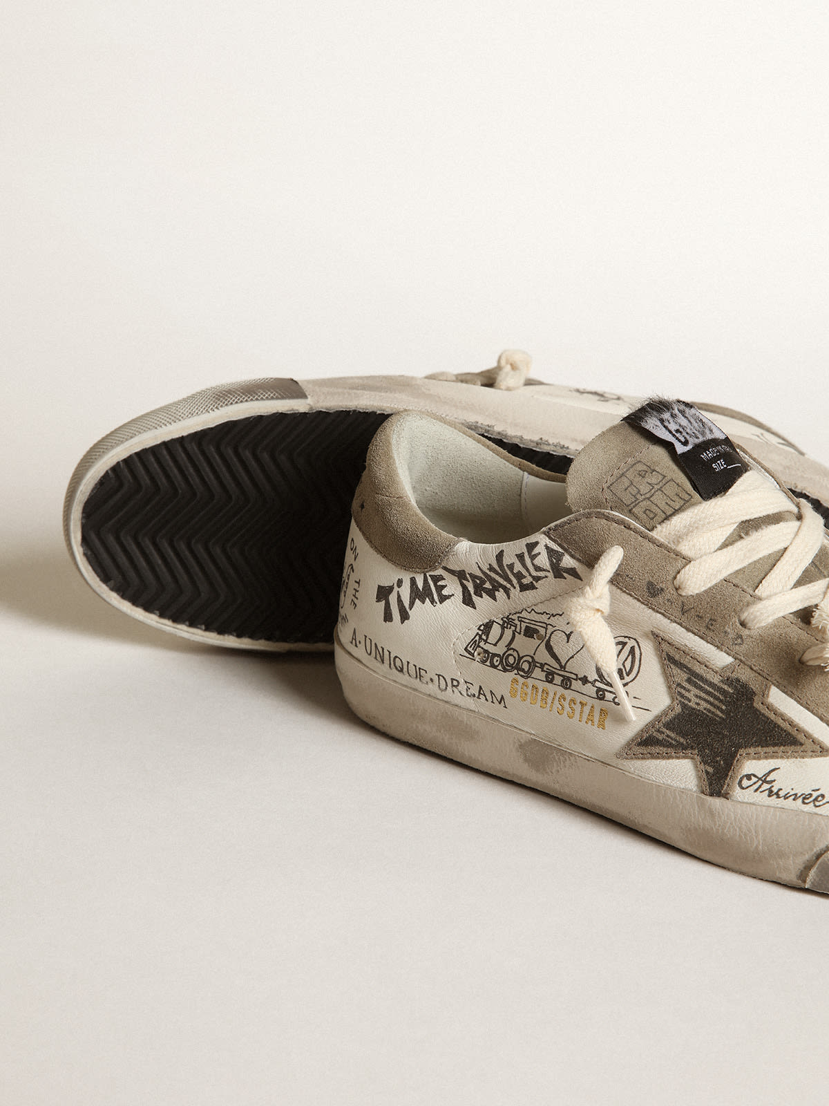 Super-Star sneakers with handwritten Love is all we need lettering