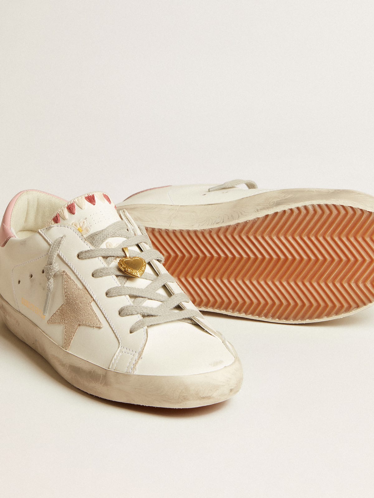 Super-Star sneakers in white leather and canvas with shocking-pink leather  star and silver glitter heel tab