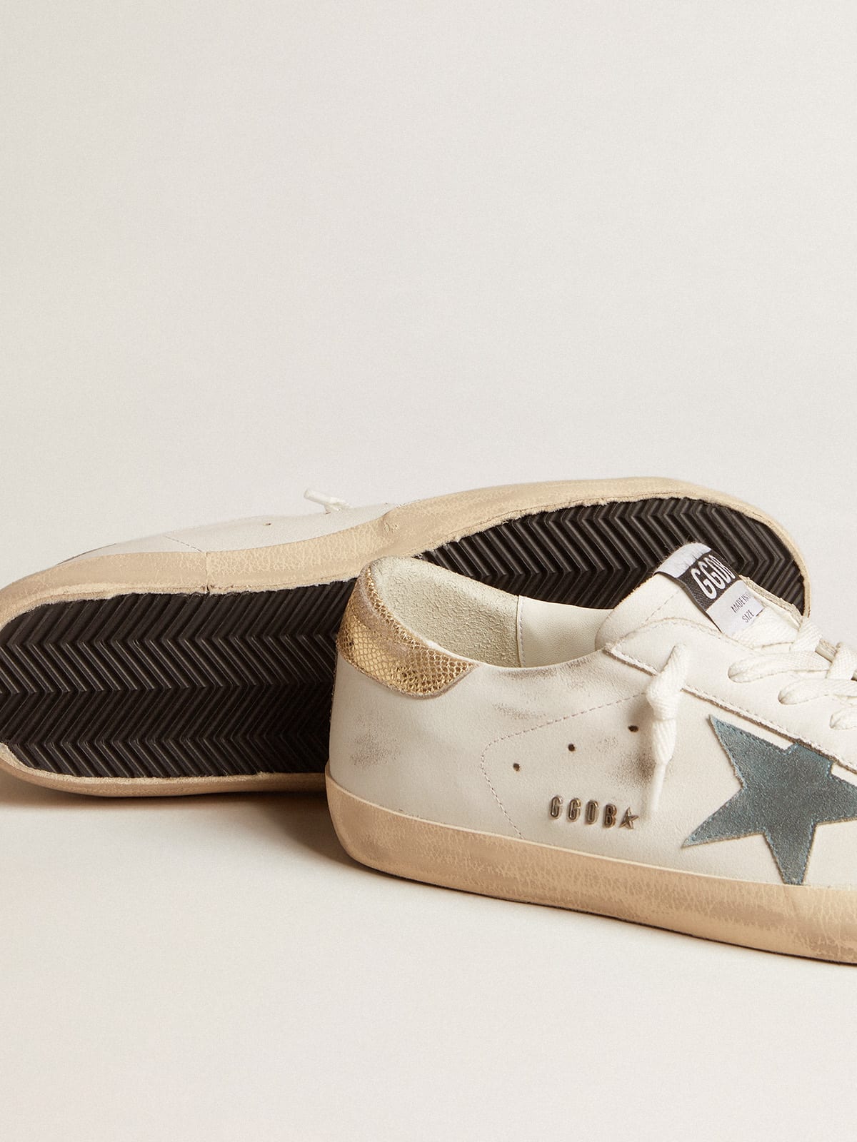 Super-Star with suede star and platinum snake-print leather heel tab