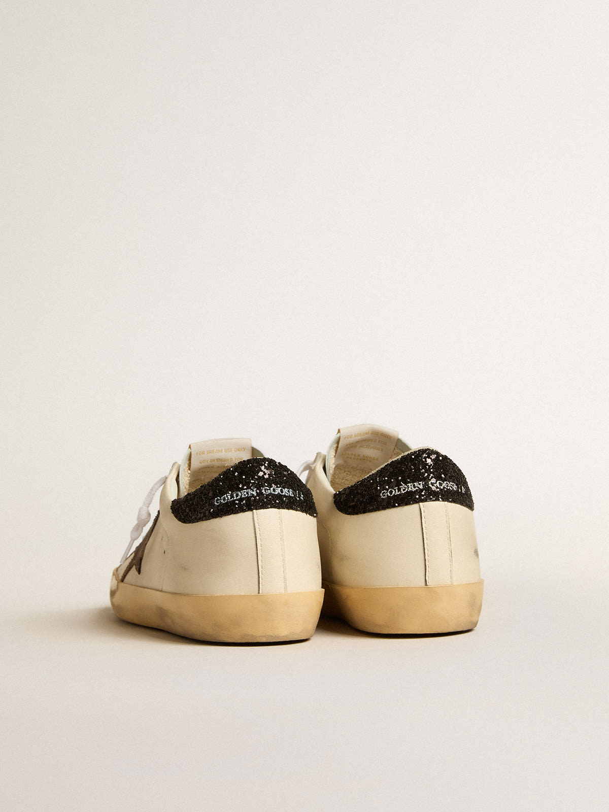 Super-Star LTD with laminated leather star and black glitter heel tab |  Golden Goose