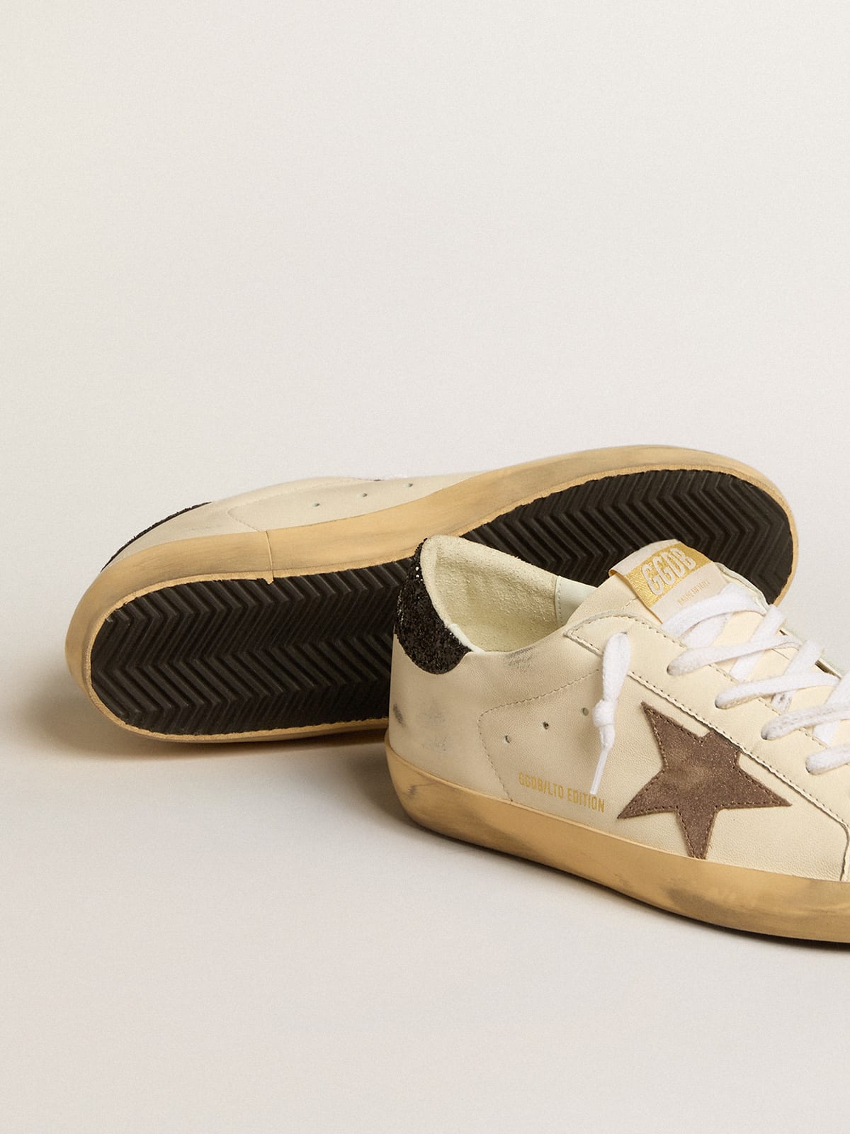 Women's Super-Star with gold star and black glitter heel tab