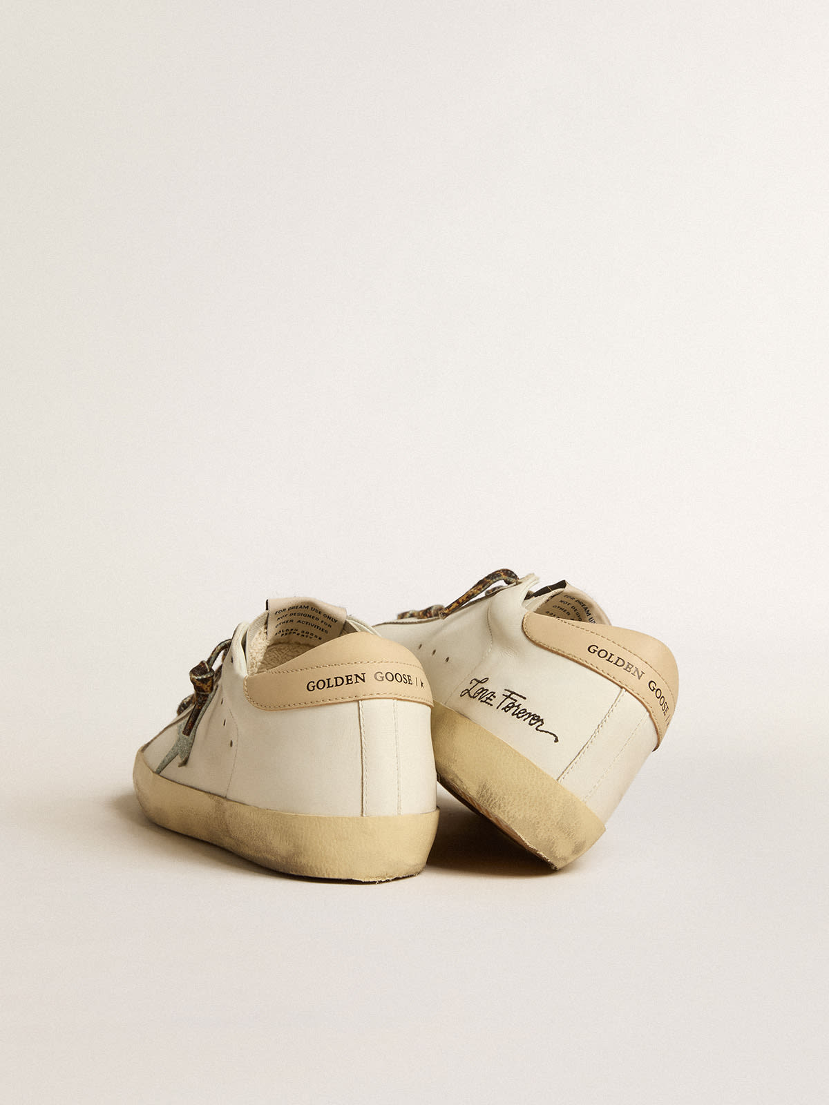 Golden Goose - Women's Super-Star with gray glitter star and nude leather heel tab in 