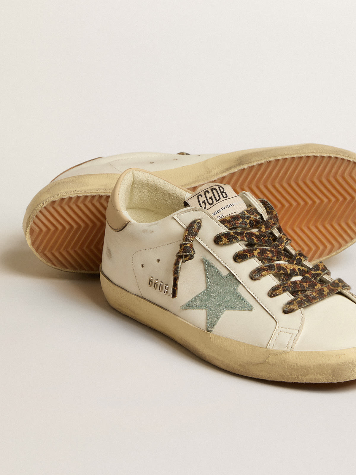 Golden Goose - Women's Super-Star with gray glitter star and nude leather heel tab in 