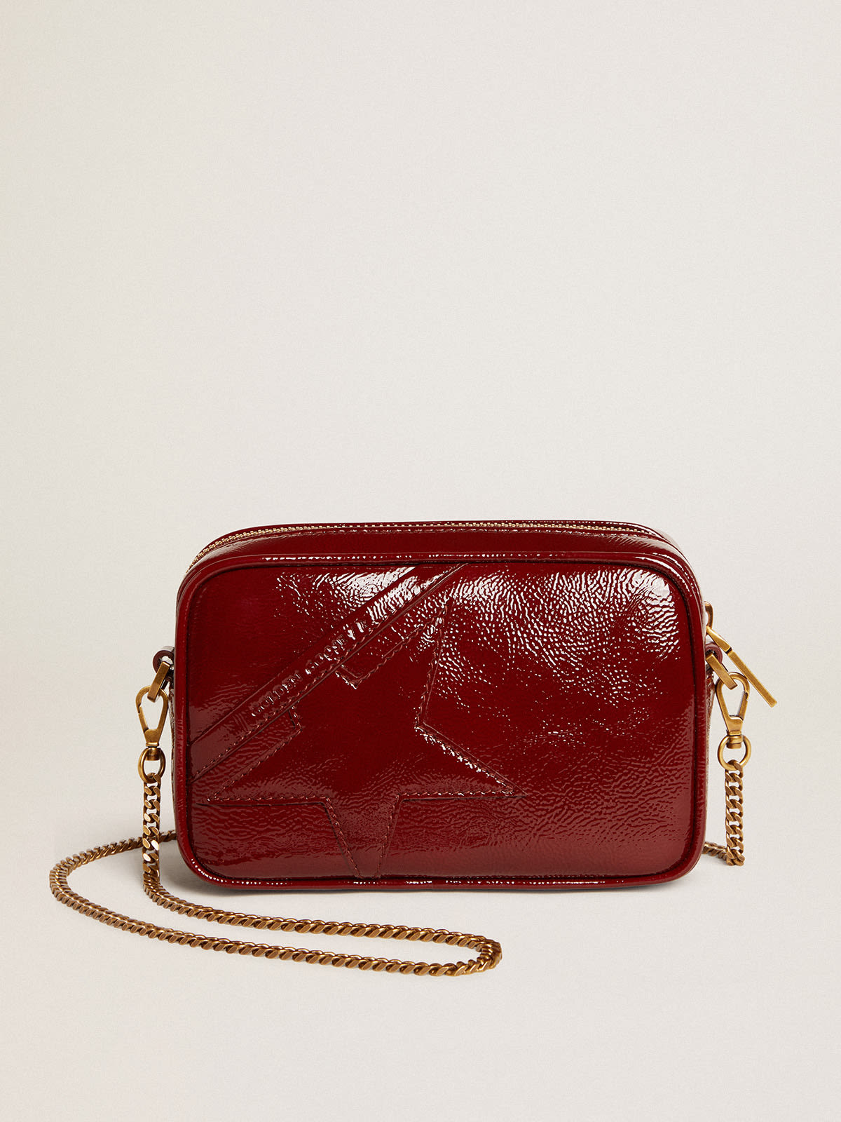 Women's Mini Star Bag in red painted leather with tone-on-tone star