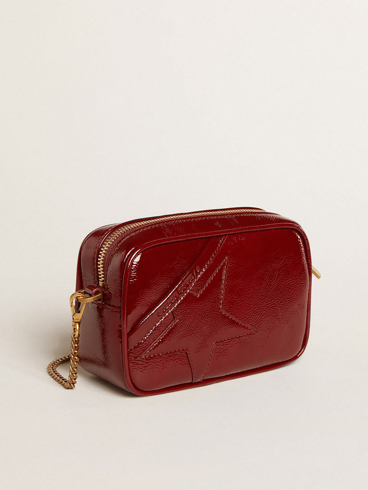 Women's Mini Star Bag in red painted leather with tone-on-tone star