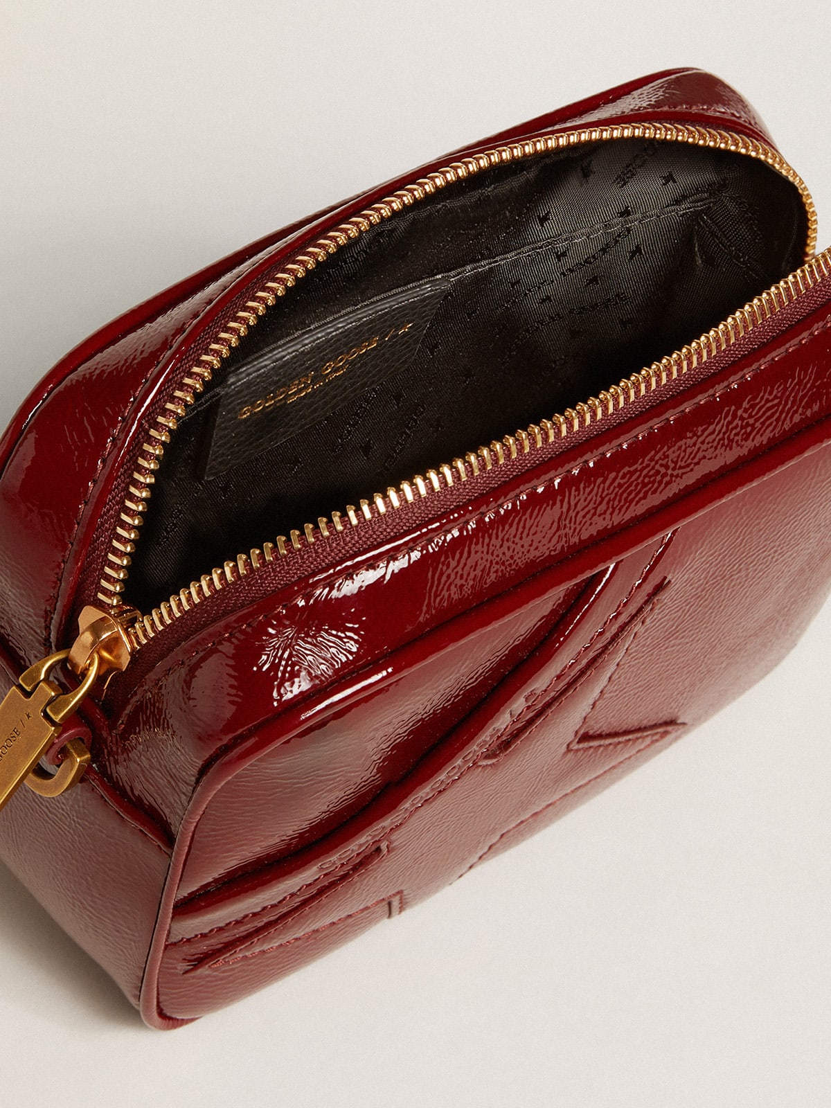 Mini Star Bag in burgundy patent leather with tone on tone star