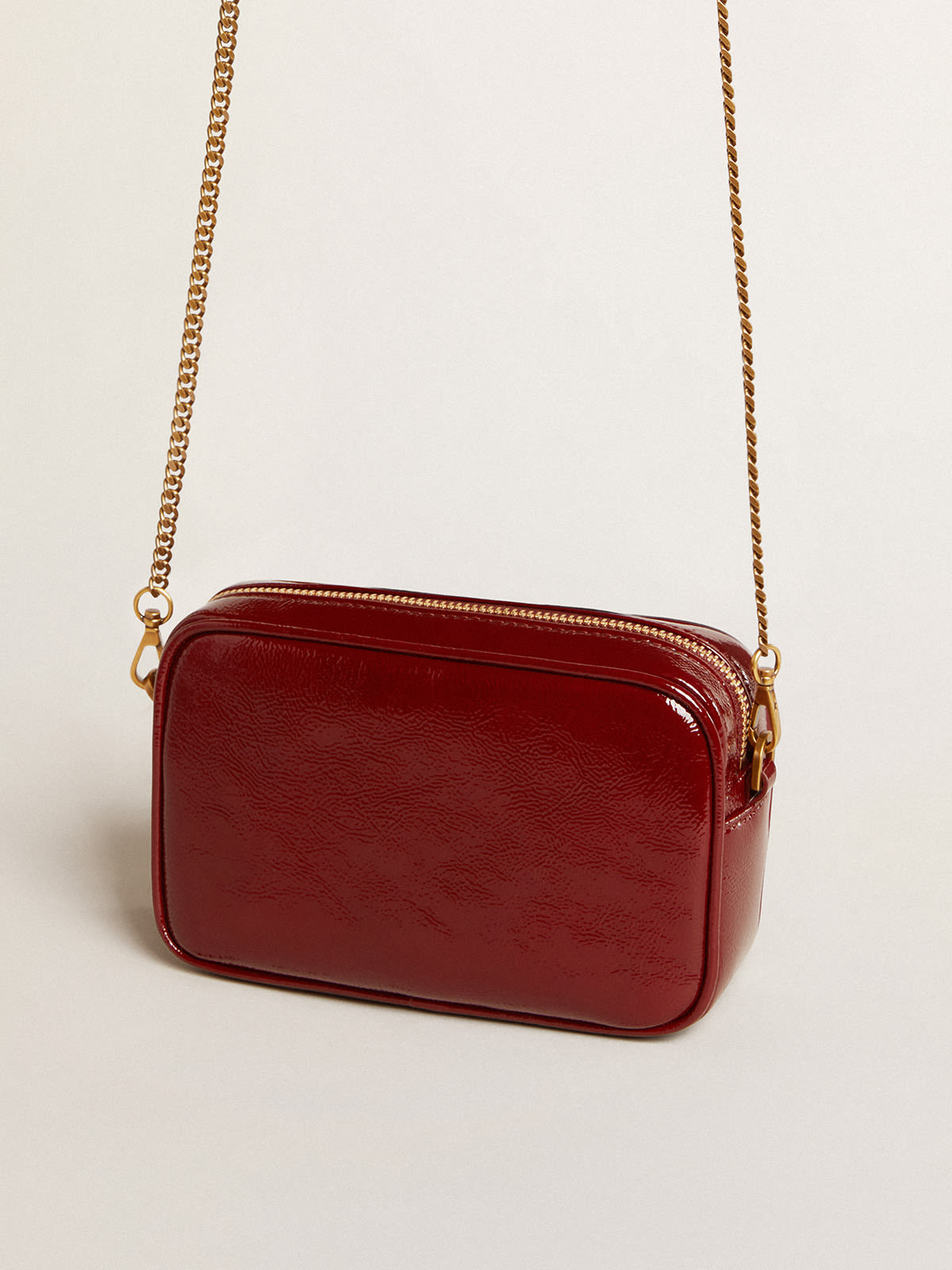 Women's Mini Star Bag in red painted leather with tone-on-tone star