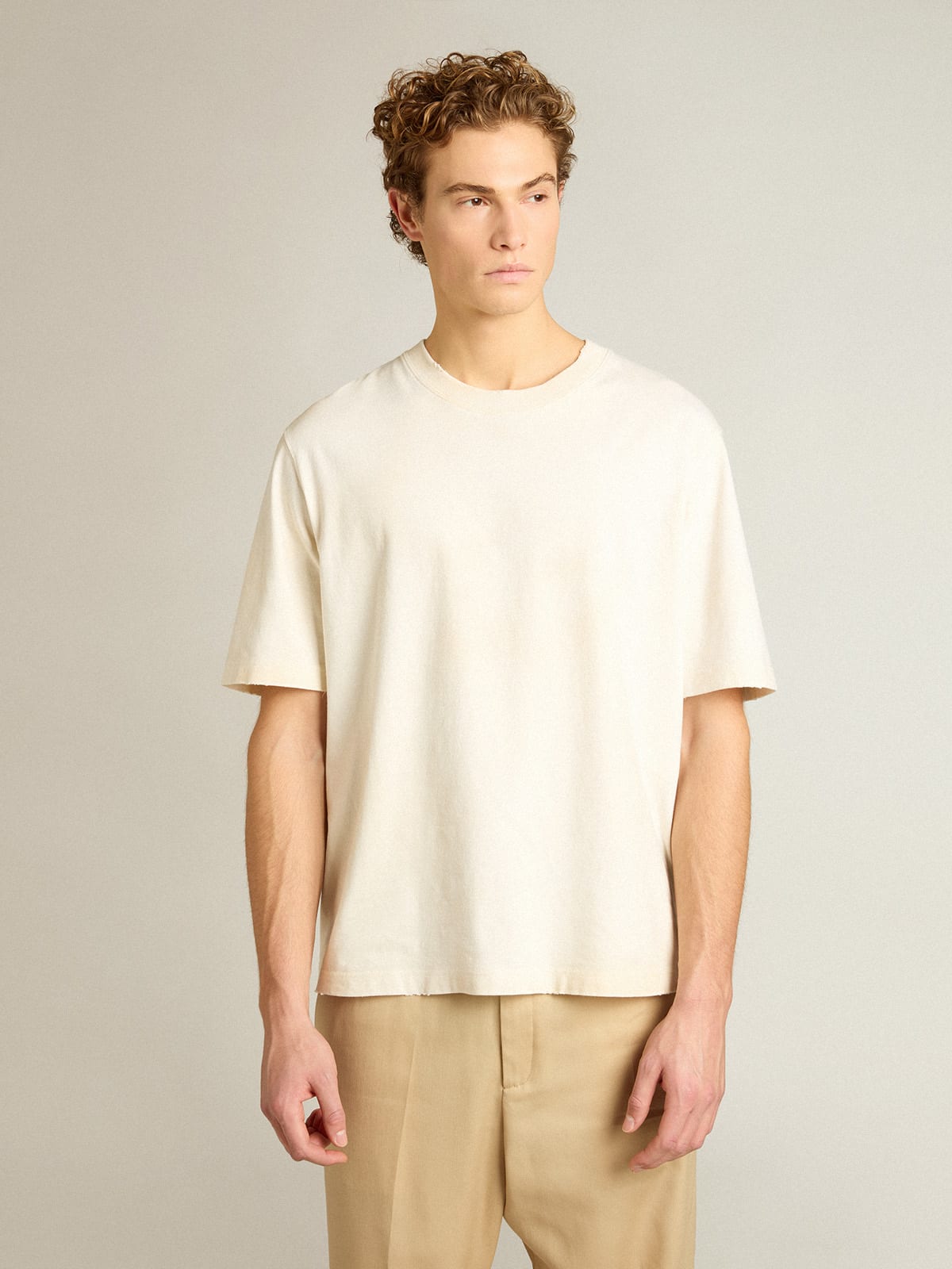 Pale pink men’s T-shirt with lettering in the center