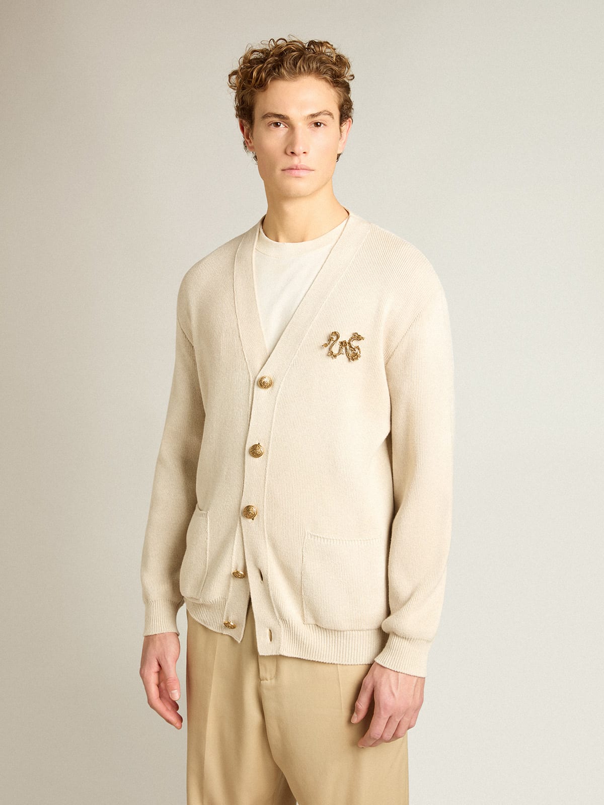 Cardigan in aged white cotton with gold button fastening